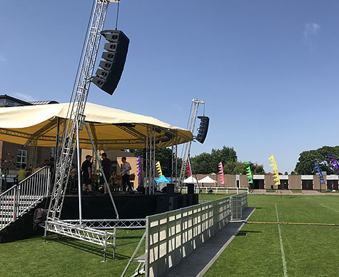 Truss-based 10m Bandstand stage roof for private school event.