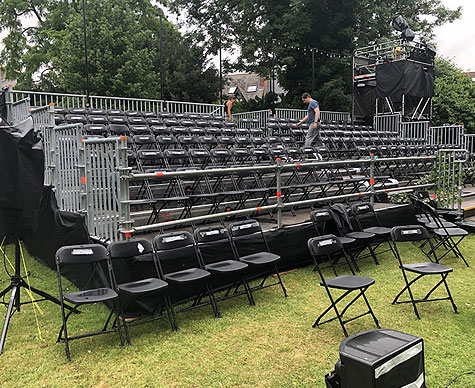 Outdoor tiered seating with camera towers.