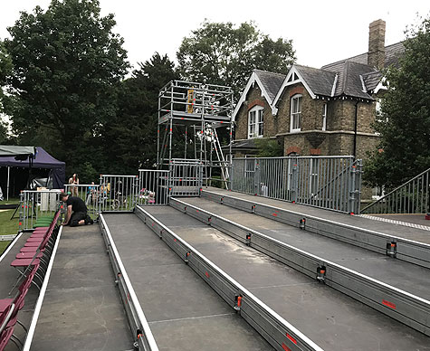 Outdoor tiered seating with camera towers.